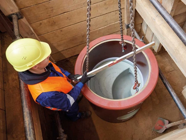 Rooter plumbing service being performed to clear tree root intrusion from a sewer line in Toronto